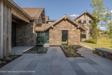 Set on a 2.43-acre Estate lot in 3 Creek Ranch, Mirror Pond on 3 Creek Ranch Golf Club in Wyoming - for sale on GolfHomes.com, golf home, golf lot