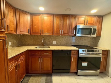 Escape to this spacious 2BR/2BA condo situated in a private on Palm-Aire Country Club and Resort - Palms in Florida - for sale on GolfHomes.com, golf home, golf lot