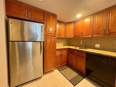 Escape to this spacious 2BR/2BA condo situated in a private on Palm-Aire Country Club and Resort - Palms in Florida - for sale on GolfHomes.com, golf home, golf lot