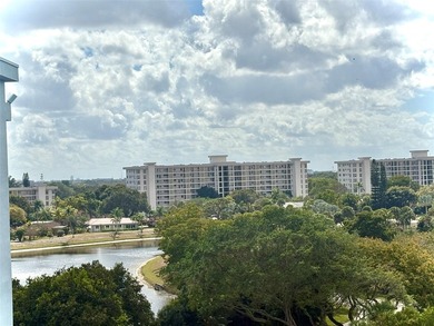 Escape to this spacious 2BR/2BA condo situated in a private on Palm-Aire Country Club and Resort - Palms in Florida - for sale on GolfHomes.com, golf home, golf lot