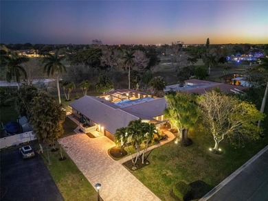 Beautiful, fully renovated modern retreat on the golf course in on Country Club of Coral Springs in Florida - for sale on GolfHomes.com, golf home, golf lot