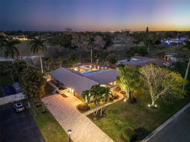 Beautiful, fully renovated modern retreat on the golf course in on Country Club of Coral Springs in Florida - for sale on GolfHomes.com, golf home, golf lot