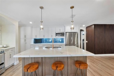 Beautiful, fully renovated modern retreat on the golf course in on Country Club of Coral Springs in Florida - for sale on GolfHomes.com, golf home, golf lot