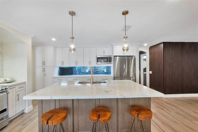 Beautiful, fully renovated modern retreat on the golf course in on Country Club of Coral Springs in Florida - for sale on GolfHomes.com, golf home, golf lot