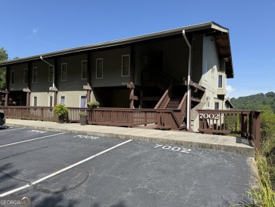 Escape to the mountains in this charming 2-bedroom, 2-bathroom on Sky Valley Resort and Country Club in Georgia - for sale on GolfHomes.com, golf home, golf lot