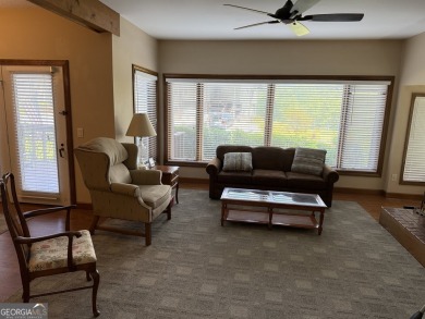 Escape to the mountains in this charming 2-bedroom, 2-bathroom on Sky Valley Resort and Country Club in Georgia - for sale on GolfHomes.com, golf home, golf lot