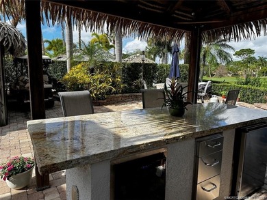 Truly an enchanting tropical retreat! Positioned on the on St. Lucie Trail Golf Club in Florida - for sale on GolfHomes.com, golf home, golf lot