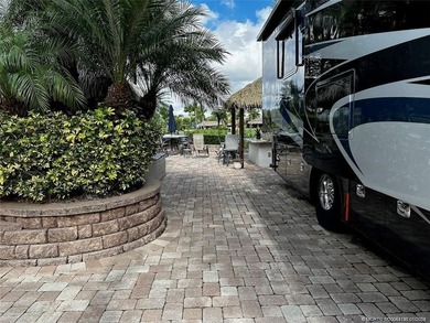 Truly an enchanting tropical retreat! Positioned on the on St. Lucie Trail Golf Club in Florida - for sale on GolfHomes.com, golf home, golf lot