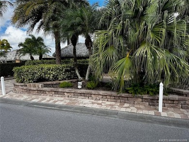 Truly an enchanting tropical retreat! Positioned on the on St. Lucie Trail Golf Club in Florida - for sale on GolfHomes.com, golf home, golf lot