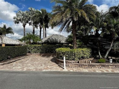 Truly an enchanting tropical retreat! Positioned on the on St. Lucie Trail Golf Club in Florida - for sale on GolfHomes.com, golf home, golf lot
