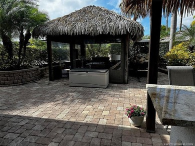 Truly an enchanting tropical retreat! Positioned on the on St. Lucie Trail Golf Club in Florida - for sale on GolfHomes.com, golf home, golf lot