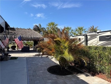 Perfectly positioned within a prestigious Class A-only resort on St. Lucie Trail Golf Club in Florida - for sale on GolfHomes.com, golf home, golf lot