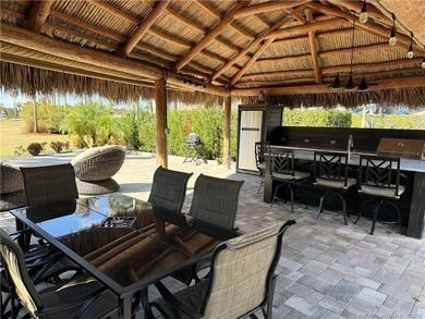 Perfectly positioned within a prestigious Class A-only resort on St. Lucie Trail Golf Club in Florida - for sale on GolfHomes.com, golf home, golf lot