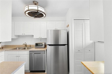 Peaceful and tranquil living comes to mind when you enter this on Miles Grant Country Club in Florida - for sale on GolfHomes.com, golf home, golf lot