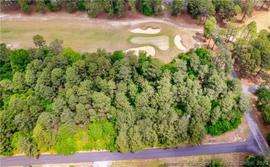 Build your dream home on this .74 acre, corner lot located on on Foxfire Golf and Country Club in North Carolina - for sale on GolfHomes.com, golf home, golf lot