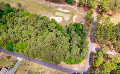 Build your dream home on this .74 acre, corner lot located on on Foxfire Golf and Country Club in North Carolina - for sale on GolfHomes.com, golf home, golf lot