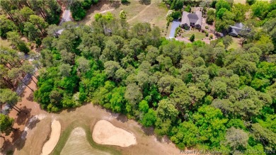 Build your dream home on this .74 acre, corner lot located on on Foxfire Golf and Country Club in North Carolina - for sale on GolfHomes.com, golf home, golf lot