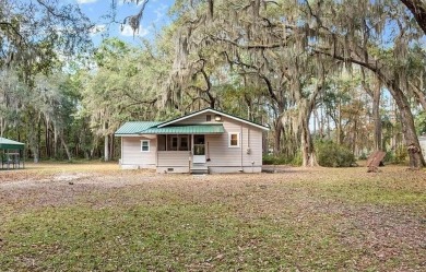 Nestled in the heart of Shellman Bluff, this two bedroom/two on Sapelo Hammock Golf Club in Georgia - for sale on GolfHomes.com, golf home, golf lot