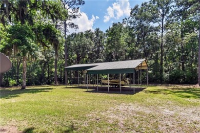 Nestled in the heart of Shellman Bluff, this two bedroom/two on Sapelo Hammock Golf Club in Georgia - for sale on GolfHomes.com, golf home, golf lot