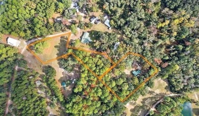 Nestled in the heart of Shellman Bluff, this two bedroom/two on Sapelo Hammock Golf Club in Georgia - for sale on GolfHomes.com, golf home, golf lot