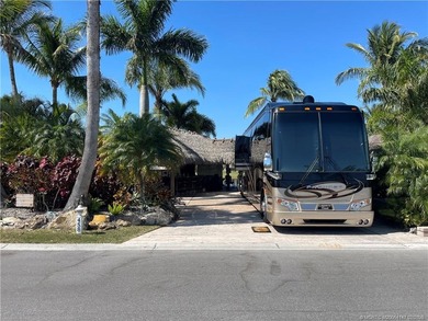 Spectacular sunset views over the lake and golf course set the on St. Lucie Trail Golf Club in Florida - for sale on GolfHomes.com, golf home, golf lot