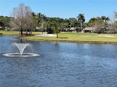 Spectacular sunset views over the lake and golf course set the on St. Lucie Trail Golf Club in Florida - for sale on GolfHomes.com, golf home, golf lot