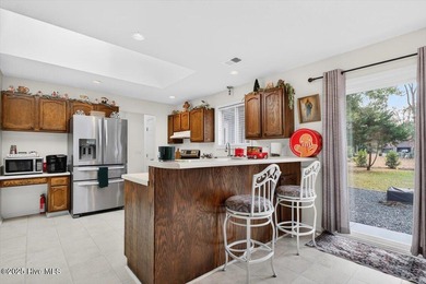 This charming 3-bedroom, 2-bath home is perfectly situated on a on Carolina Shores Golf Course in North Carolina - for sale on GolfHomes.com, golf home, golf lot