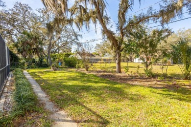 Embrace the essence of living the Florida Dream in this stunning on The Dunedin Country Club in Florida - for sale on GolfHomes.com, golf home, golf lot