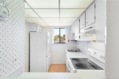 Second Floor 1/1.5 Condo with golf course views in Miles Grant on Miles Grant Country Club in Florida - for sale on GolfHomes.com, golf home, golf lot