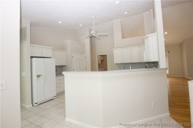 Nestled in the desirable Whispering Pines community and backing on Whispering Woods in North Carolina - for sale on GolfHomes.com, golf home, golf lot