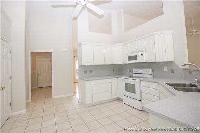Nestled in the desirable Whispering Pines community and backing on Whispering Woods in North Carolina - for sale on GolfHomes.com, golf home, golf lot