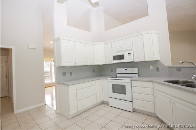 Nestled in the desirable Whispering Pines community and backing on Whispering Woods in North Carolina - for sale on GolfHomes.com, golf home, golf lot