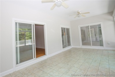 Nestled in the desirable Whispering Pines community and backing on Whispering Woods in North Carolina - for sale on GolfHomes.com, golf home, golf lot
