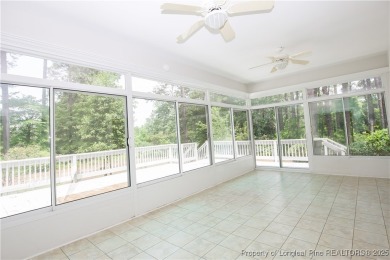 Nestled in the desirable Whispering Pines community and backing on Whispering Woods in North Carolina - for sale on GolfHomes.com, golf home, golf lot