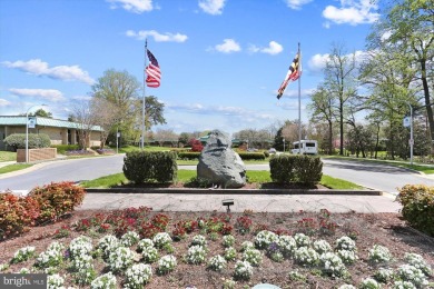 Experience peaceful and maintenance-free living in this bright on Leisure World Golf Club in Maryland - for sale on GolfHomes.com, golf home, golf lot