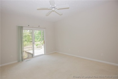 Nestled in the desirable Whispering Pines community and backing on Whispering Woods in North Carolina - for sale on GolfHomes.com, golf home, golf lot