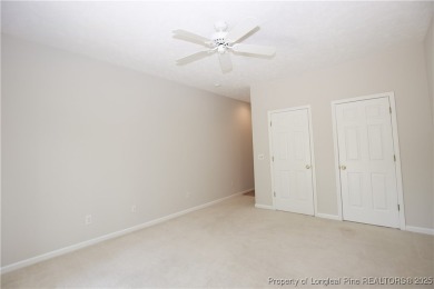 Nestled in the desirable Whispering Pines community and backing on Whispering Woods in North Carolina - for sale on GolfHomes.com, golf home, golf lot