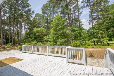 Nestled in the desirable Whispering Pines community and backing on Whispering Woods in North Carolina - for sale on GolfHomes.com, golf home, golf lot