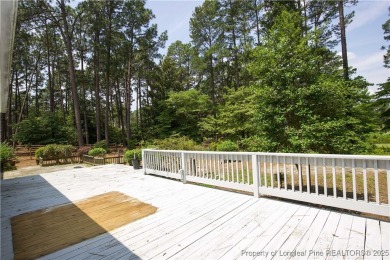 Nestled in the desirable Whispering Pines community and backing on Whispering Woods in North Carolina - for sale on GolfHomes.com, golf home, golf lot