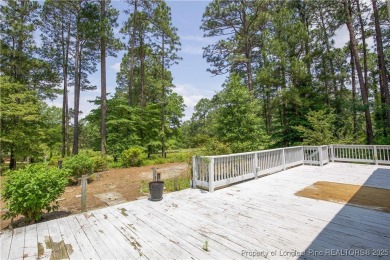 Nestled in the desirable Whispering Pines community and backing on Whispering Woods in North Carolina - for sale on GolfHomes.com, golf home, golf lot