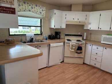 This home is in a 55 plus community with a monthly lot rent of on Crystal Lake Club in Florida - for sale on GolfHomes.com, golf home, golf lot