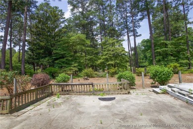 Nestled in the desirable Whispering Pines community and backing on Whispering Woods in North Carolina - for sale on GolfHomes.com, golf home, golf lot