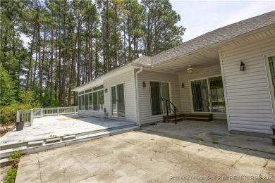 Nestled in the desirable Whispering Pines community and backing on Whispering Woods in North Carolina - for sale on GolfHomes.com, golf home, golf lot