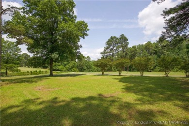 Nestled in the desirable Whispering Pines community and backing on Whispering Woods in North Carolina - for sale on GolfHomes.com, golf home, golf lot