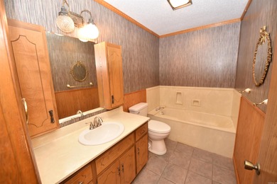 Beautiful one-level home in Fairfield Bay with stunning views of on Indian Hills Country Club in Arkansas - for sale on GolfHomes.com, golf home, golf lot