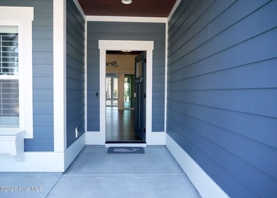 Step inside this luxury coastal craftsman, pristine Riptide home on Sea Trail Golf Resort in North Carolina - for sale on GolfHomes.com, golf home, golf lot