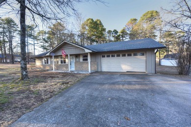 Beautiful one-level home in Fairfield Bay with stunning views of on Indian Hills Country Club in Arkansas - for sale on GolfHomes.com, golf home, golf lot