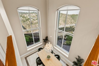 This stunning townhouse with panoramic mountain and hillside on Mountain Gate Country Club in California - for sale on GolfHomes.com, golf home, golf lot
