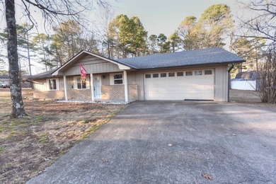 Beautiful one-level home in Fairfield Bay with stunning views of on Indian Hills Country Club in Arkansas - for sale on GolfHomes.com, golf home, golf lot