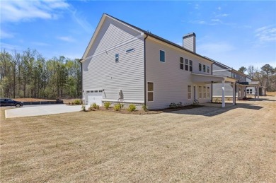 Nestled in the sought-after Traditions of Braselton community on Traditions of Braselton Golf Club in Georgia - for sale on GolfHomes.com, golf home, golf lot